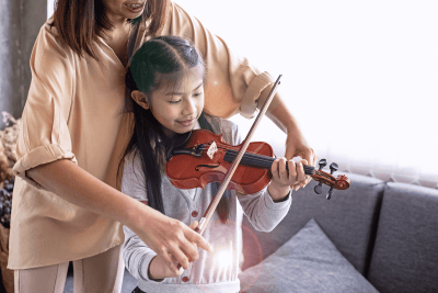 teacher teach girl violin