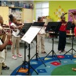 teachers teach kids violins