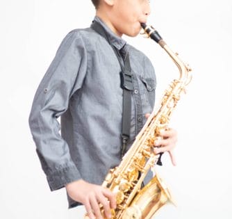 boy playing saxophone